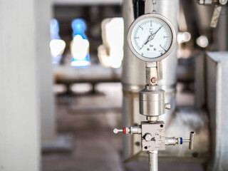 Pressure gauge of measuring instrument close up in industry zone at power plant with closed up