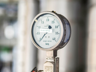 Pressure gauge of measuring instrument close up in industry zone at power plant with closed up