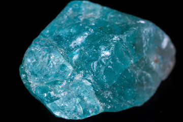 Obraz premium Macro mineral stone apatite on black background
