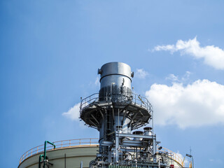 Stack and sky of Heat recovery steam generator in Combined-Cycle Co-Generation Power Plant.