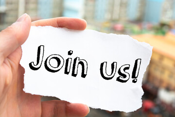 Hand with marker writing: Join Us