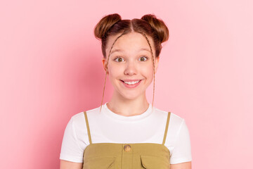 Portrait of attractive cheerful funky pre-teen foxy ginger girl smiling isolated over pink pastel color background