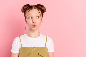 Portrait of attractive funky minded pre-teen girl sending air kiss copy space isolated over pink...