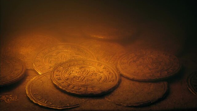 Gold Coins On The Sea Floor Lit Up By Torch