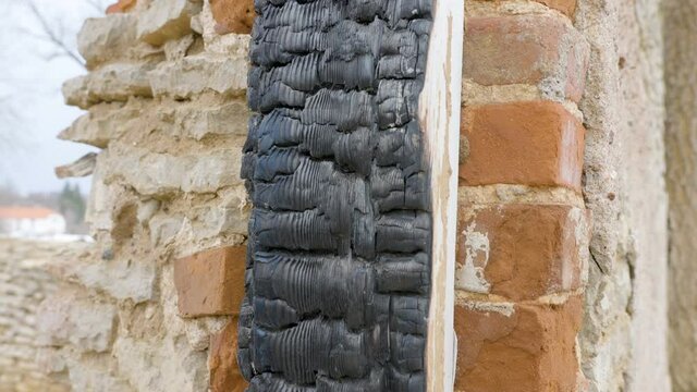 Closer look of the burnt ream of the window from the ruined house