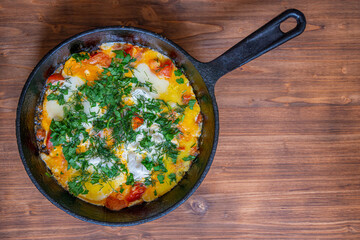 Poached eggs with tomatoes and spices