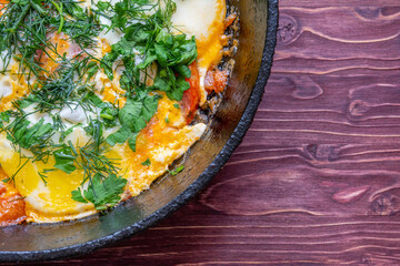 Poached eggs with tomatoes and spices