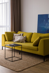 Modern yellow sofa in bright living room