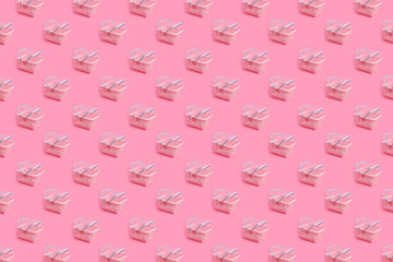 Pattern with pink plastic shopping basket on pink pastel background. Creative minimalist design....