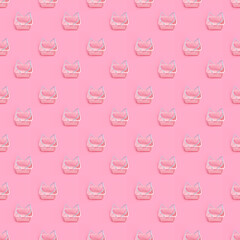 Pattern with pink plastic shopping basket on pink pastel background. Creative minimalist design. Black friday, discount, advertising and sale concept. Trendy minimal design art for poster, branding