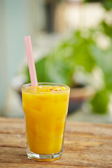 Cool orange juice on an outdoor table
