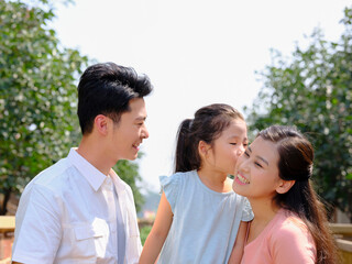 Fototapeta premium Happy family of three in the outdoor group photo