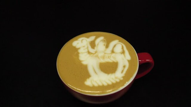 hand of barista making latte or cappuccino coffee pouring milk making latte art