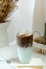 delicious iced chocolate ​mint latte on table in cafe	