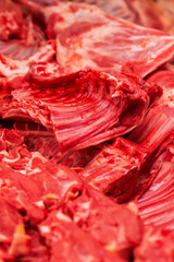 Fresh red meat on the market counter. Healthy eating. Close-up. Vertical.