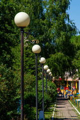 lanterns in the form of a ball stand along the road