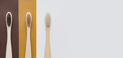 Set of eco-friendly, bamboo toothbrushes. Organic bathroom beauty products. Zero waste and plastic free concept. Environmental trends, sustainable lifestyle.