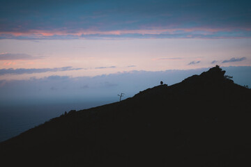 Silhouette of a tree on the hills of Jaizkibel during sunset