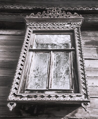 The window of an old Russian wooden house from the times of the Russian Empire.