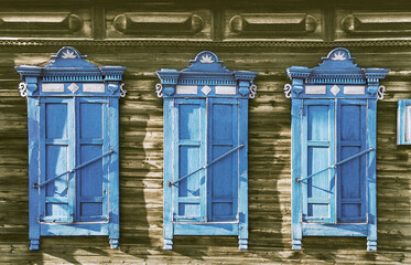 The window of an old Russian wooden house from the times of the Russian Empire.