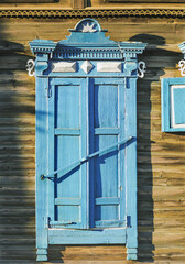 The window of an old Russian wooden house from the times of the Russian Empire.
