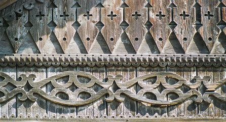 Carved details of the facade of an old Russian wooden house from the times of the Russian Empire.