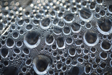 Bubbles at the bottom surface of the pan with boiling water
