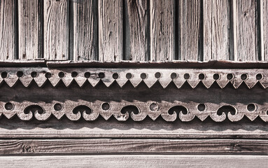Carved details of the facade of an old Russian wooden house from the times of the Russian Empire.