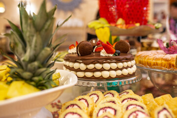 sweet chocolate cake with beautiful decoration on the table.