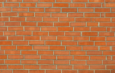 A grungy brick wall texture as background.