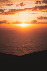 Obraz premium Golden sunset behind the clouds in Jaizkibel, Basque Country