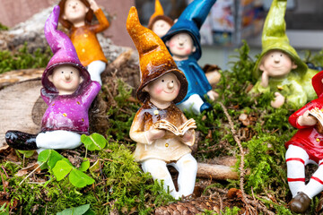 Cute gnome family with moss and brushwood decoration