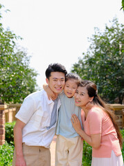 Happy family of three in the outdoor group photo