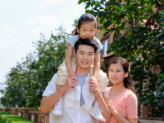 Happy family of three in the outdoor group photo