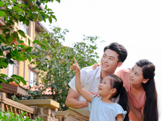 Happy family of three in the outdoor group photo