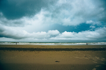 Vintage and retro toning of tropical beach with blue sky and clear sea which including of a wooden umbrella and chair in sunrise time with vintage retro tone. Vacation time as concept.