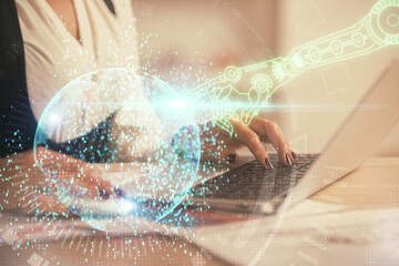 Fototapeta premium Multi exposure of woman hands working on computer and data theme hologram drawing. Tech concept.