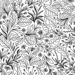 Seamless pattern with different wildflowers and leaves on a white background in vector