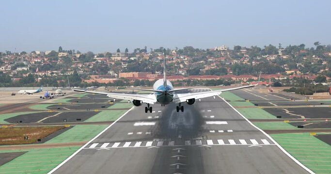 Close up back view landing airplane. 4K transportation video with runaway view