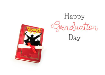 Happy Graduation Day greeting day. Graduation diploma, book, paper silhouet of graduate student isolated on white background. 