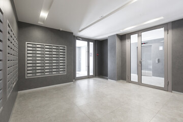 mailboxes in the lobby of an apartment building