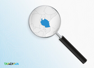 Magnifier with map of Tanzania on abstract topographic background.