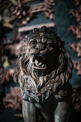 Fototapeta na wymiar Stone statue of a roaring lion in Bali