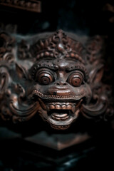 Balinese statue Stone figure of the God. Water Palace of Tirta Gangga in East Bali, Indonesia.