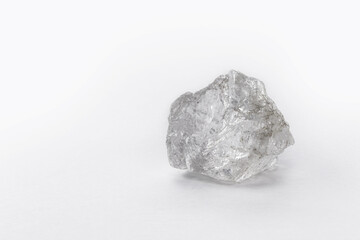 large rough diamond stone on isolated white background.