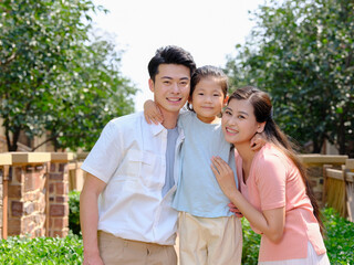 Happy family of three in the outdoor group photo