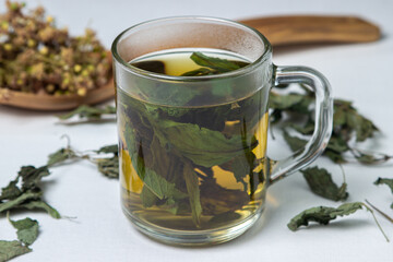 Herbal treatment. Brewed mint tea. Dried mint and linden