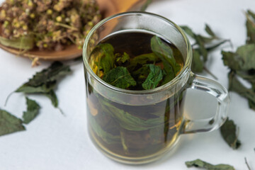 Herbal treatment. Brewed mint tea. Dried mint and linden
