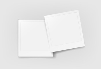 Two blank paper frames on a table