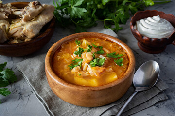 A hearty lunch: chicken soup with cabbage and vegetables. Russian cuisine: soup with chicken.
